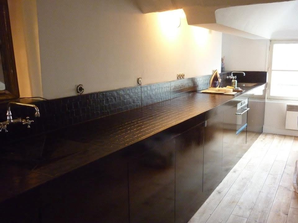 Rue du Louvre — bespoke dark-tiled kitchen