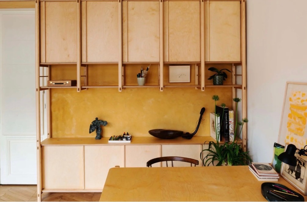 Plywood kitchen with ochre lime-washed wall